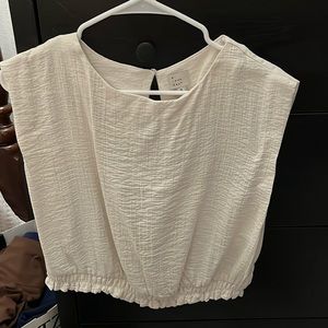 Cream bottom ruffle top